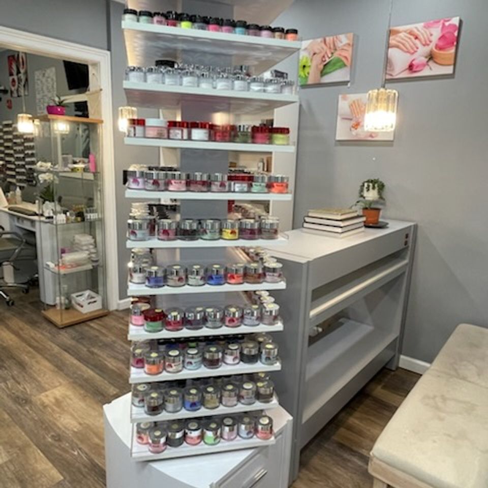Vertical shelf showcasing nail and hair products at Nail Lovers in Sound Beach NY