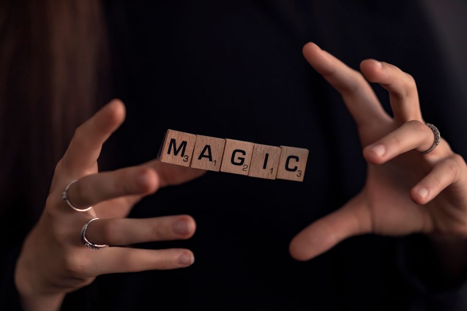 Magic hands fingers wooden squares with letters 2024 10 13 08 08 30 utc