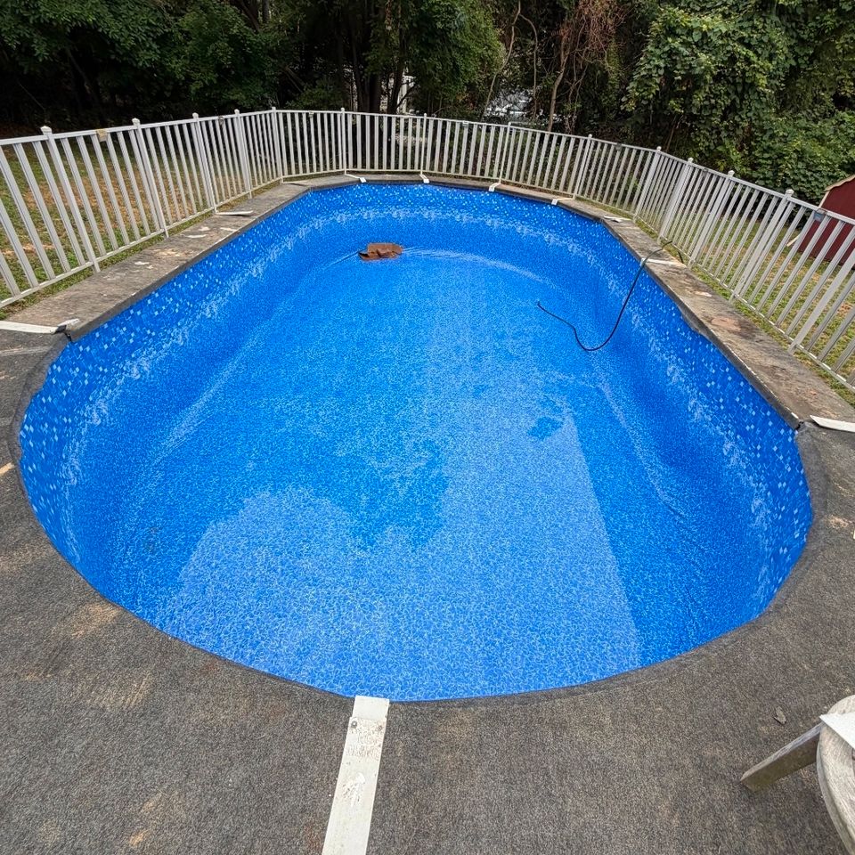 Above ground pool with a new patterned liner set on a level backyard pad in Long Island NY