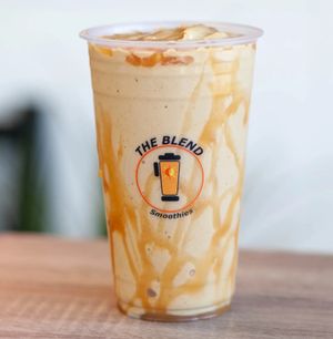Caramel You smoothie made with almond milk, frozen yogurt, caramel, coffee, and topped with caramel drizzle.