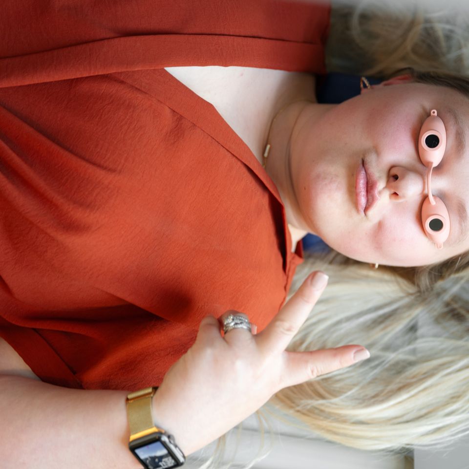 Woman wearing protective eyewear while relaxing in a tanning bed in Columbiana AL