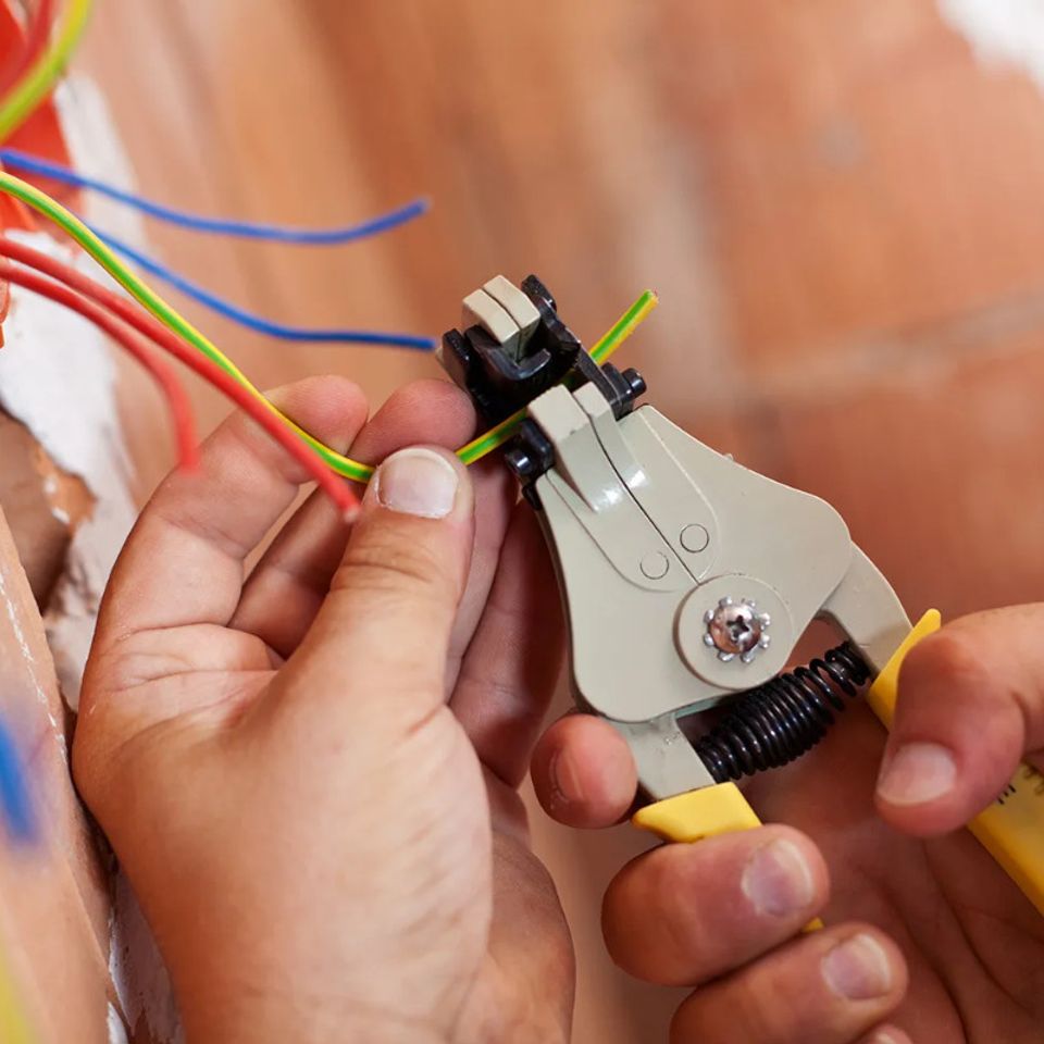 Pictured here, we are working on the wiring during a repair of an HVAC unit.