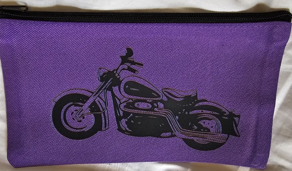 Purple zippered pouch featuring a black motorcycle graphic on the front.