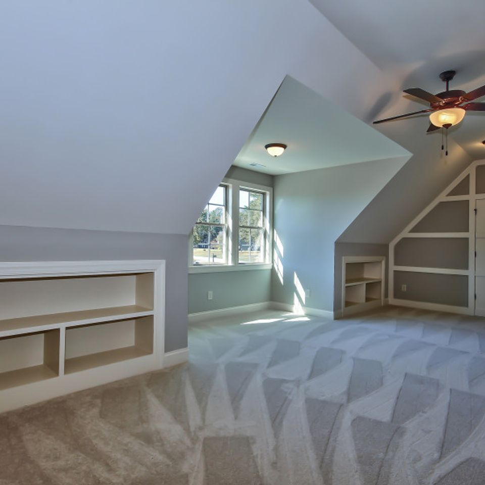 Lot 2 bc bonus room carpet angled walls built in shleves