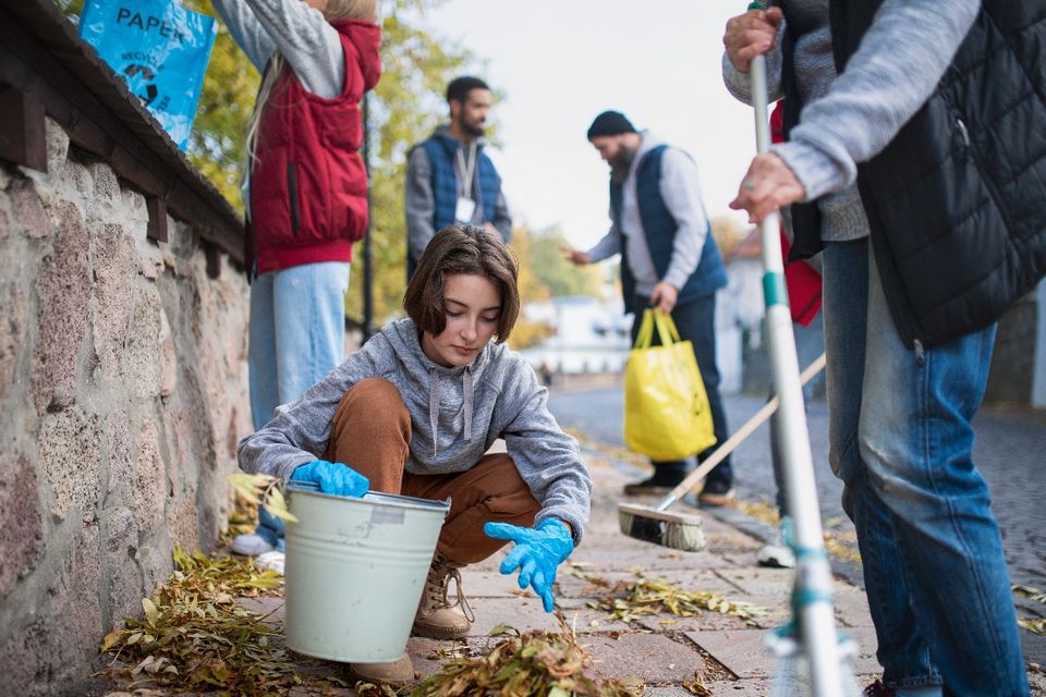 Diverse group of happy volunteers cleaning up stre 2024 10 21 18 55 12 utc