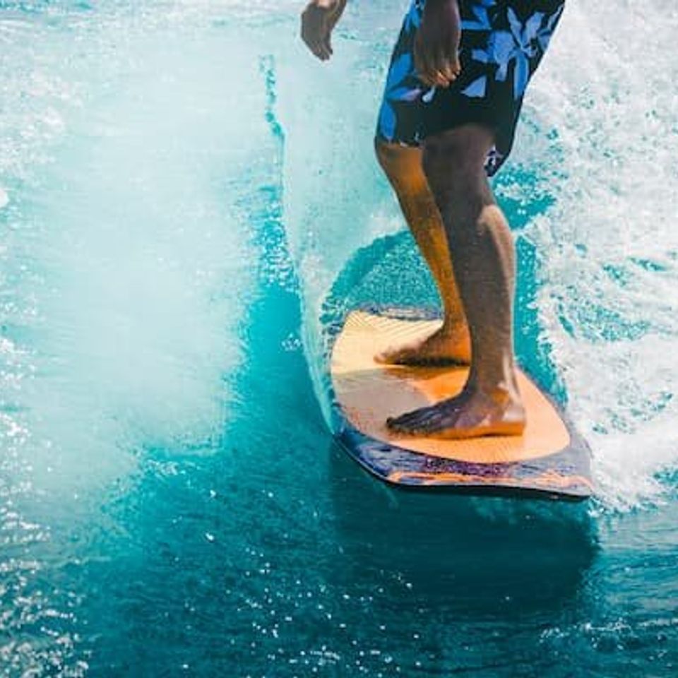 Person wake surfing - shown from the waist down