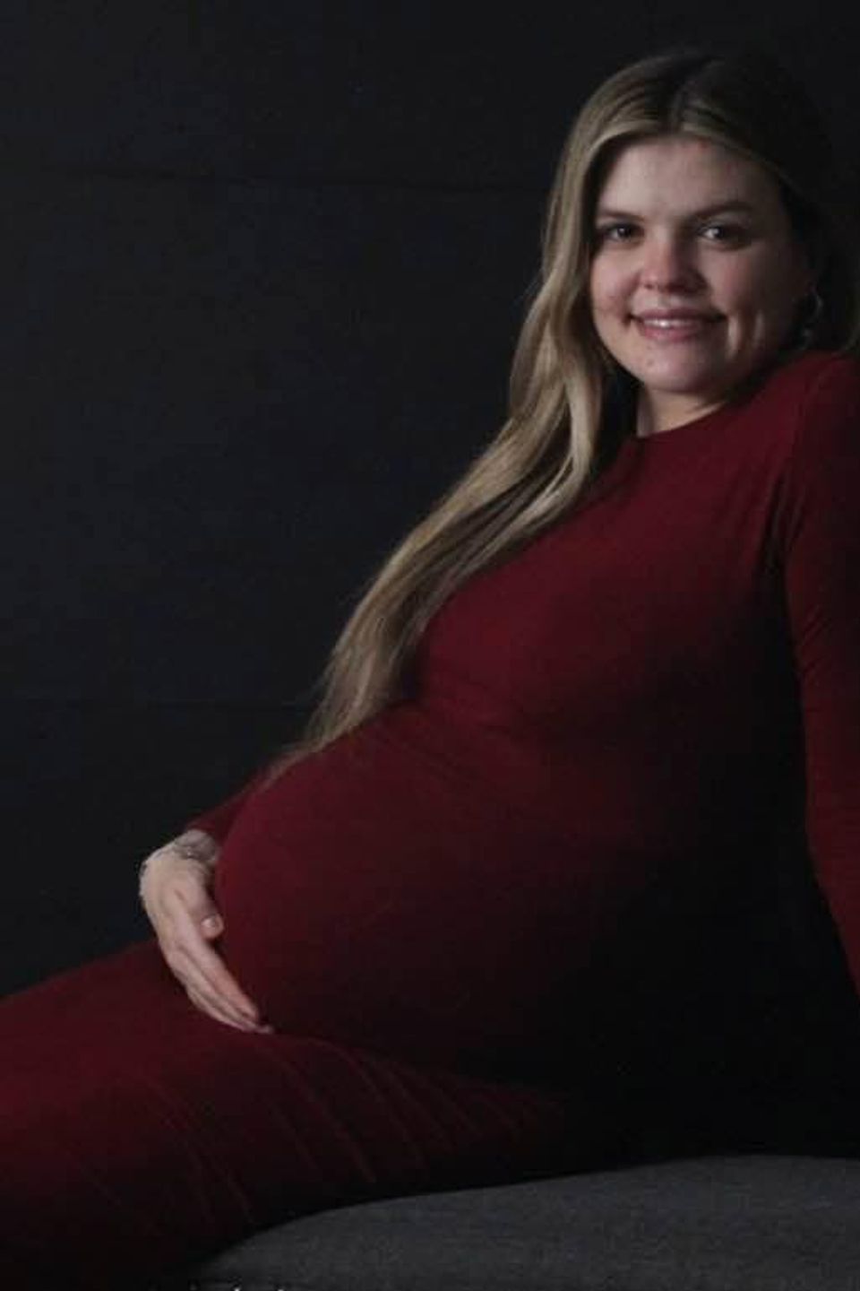 Pregnant woman in red dress