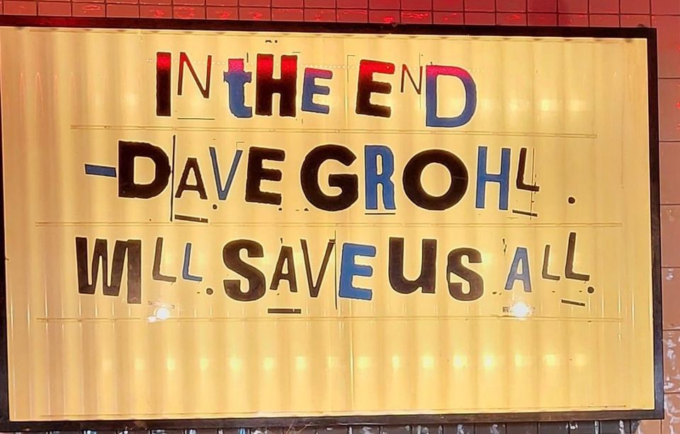 Marquee with mismatched letters that read "In the End Dave Grohl will Save us All."