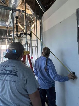 Plumber working commerial job