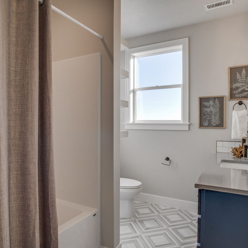 White and Gray Bathroom Featured Remodeling and Additions