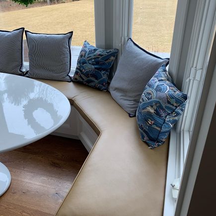 Residential leather bench under windows