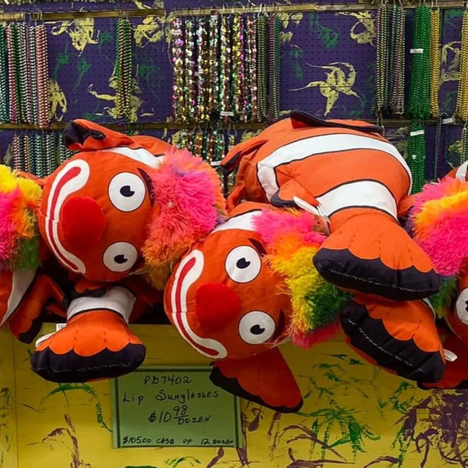 Orange and white striped stuffed animal fish for Mardi Gras and parade throws
