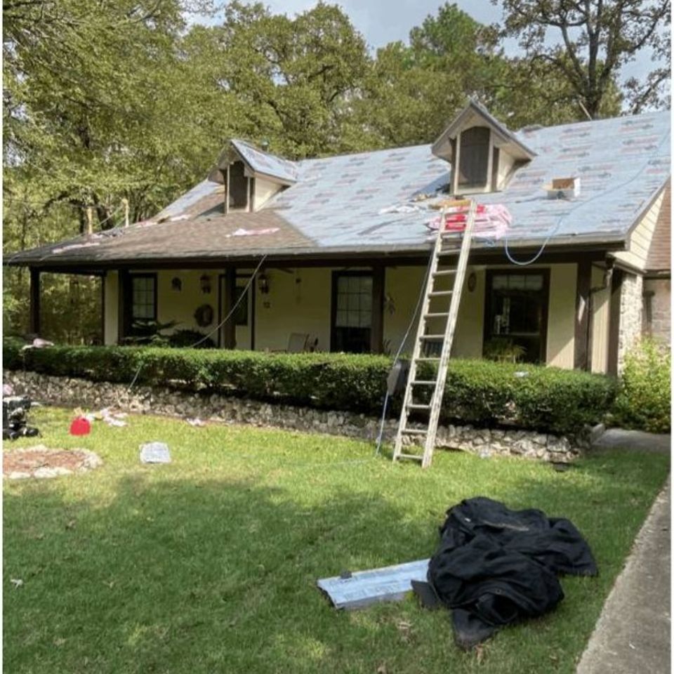 Roof underlayment installation during residential roofing project in Spring Texa