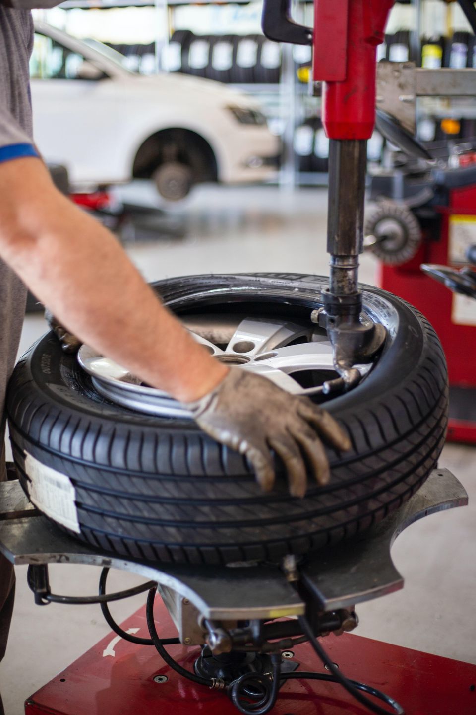 Image of a tire being mounted by a technician