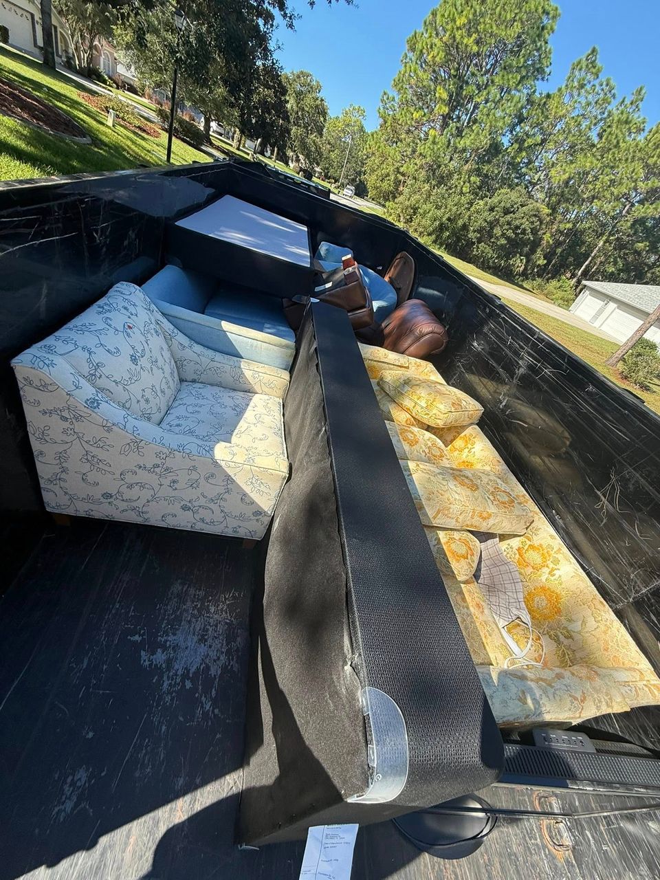 Furniture in the back of the JNJ Hauling Solutions truck