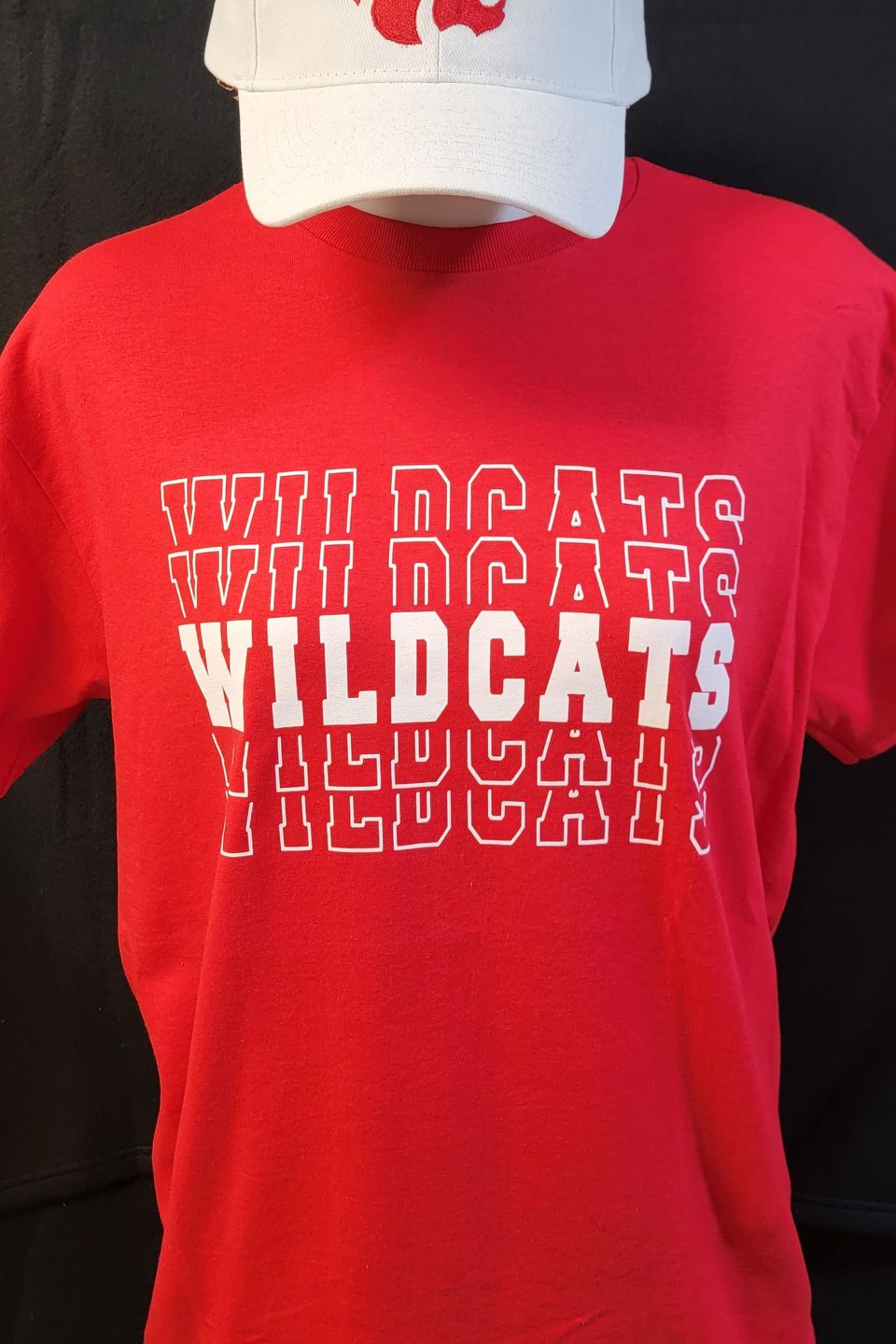 Example of Direct to Film (DTF) transfer - alternate Wildcats logo on a red t-shirt, embroidered & logo cap 