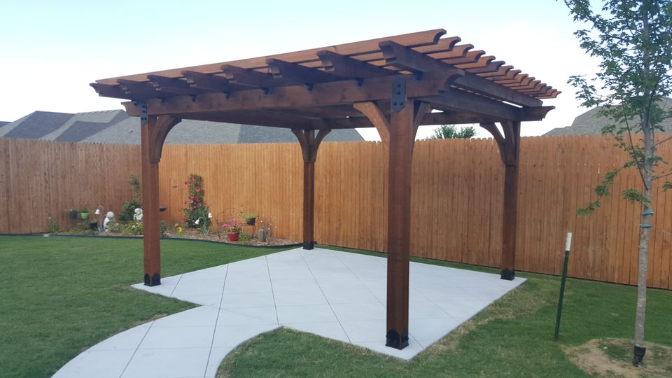 Pergola on scored concrete pad with sidewalk