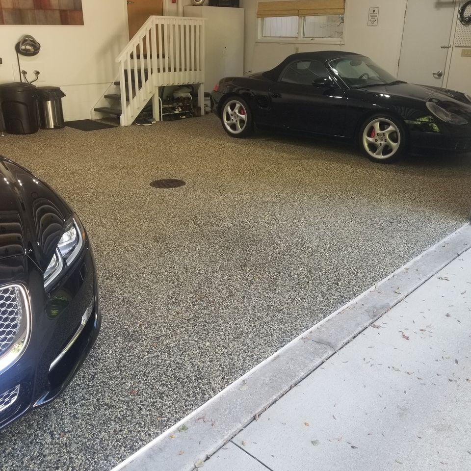 Residential garage featuring a durable EverStone decorative stone floor.