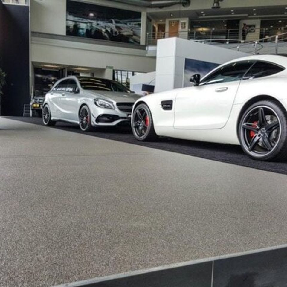 EverStone decorative stone flooring installed in an automotive showroom.