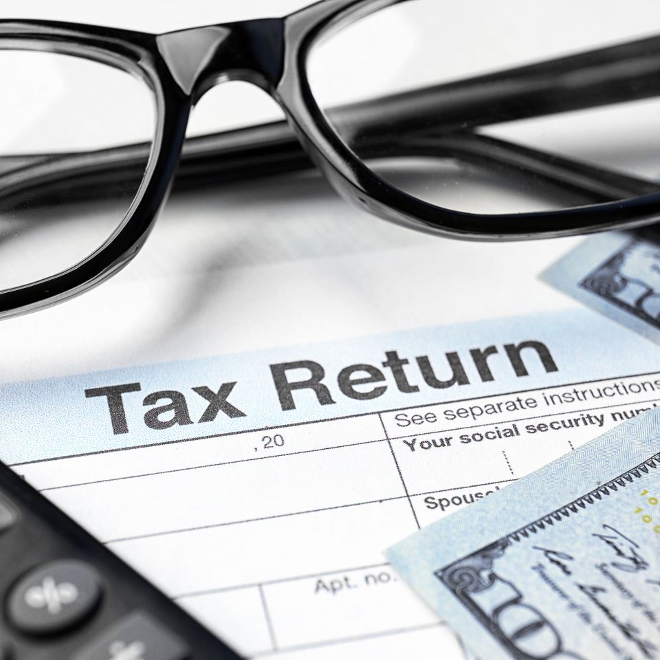 Bigstock tax return form glasses calc 180532114