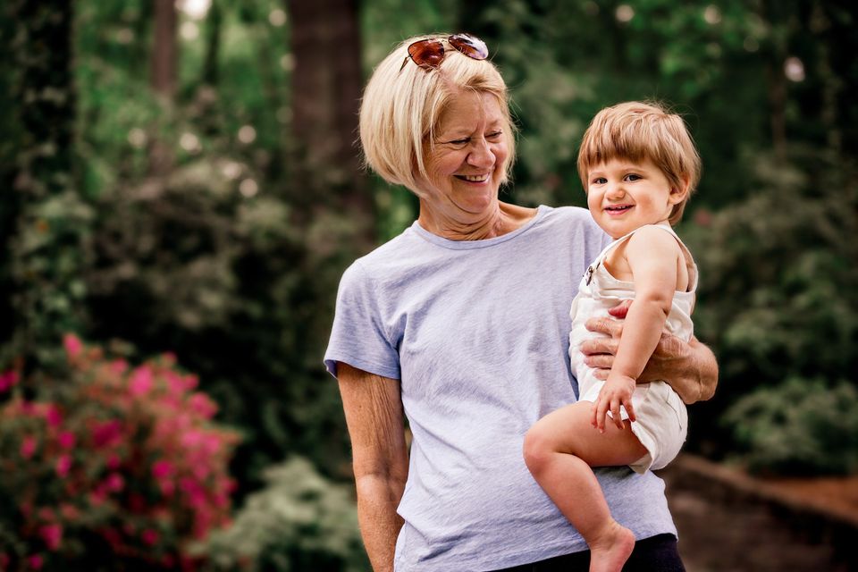 A grandmother holding her grandchild with a warm smile, representing family protection and peace of mind with Stewart & Associates Insurance. Secure your family’s future with personalized coverage.
