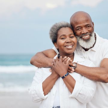 I am him he is me shot mature couple spending time beach