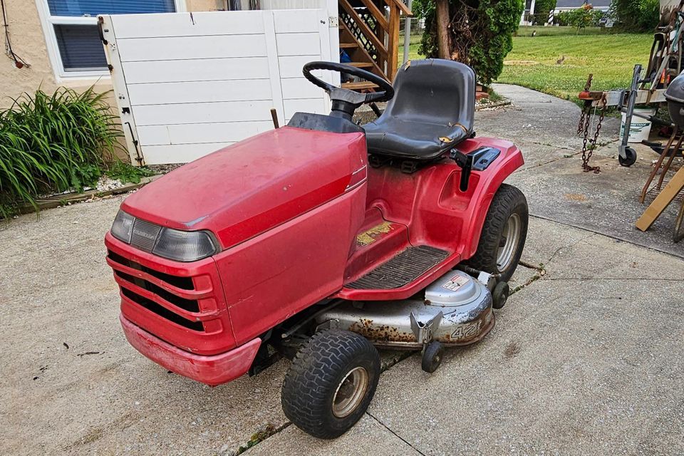 Red riding lawn mower