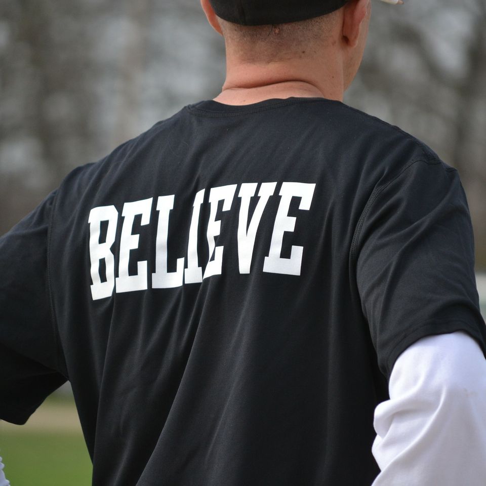 Black shirt with 'believe' in white letters on the back - heat transfer vinyl decal from Sari's Creations