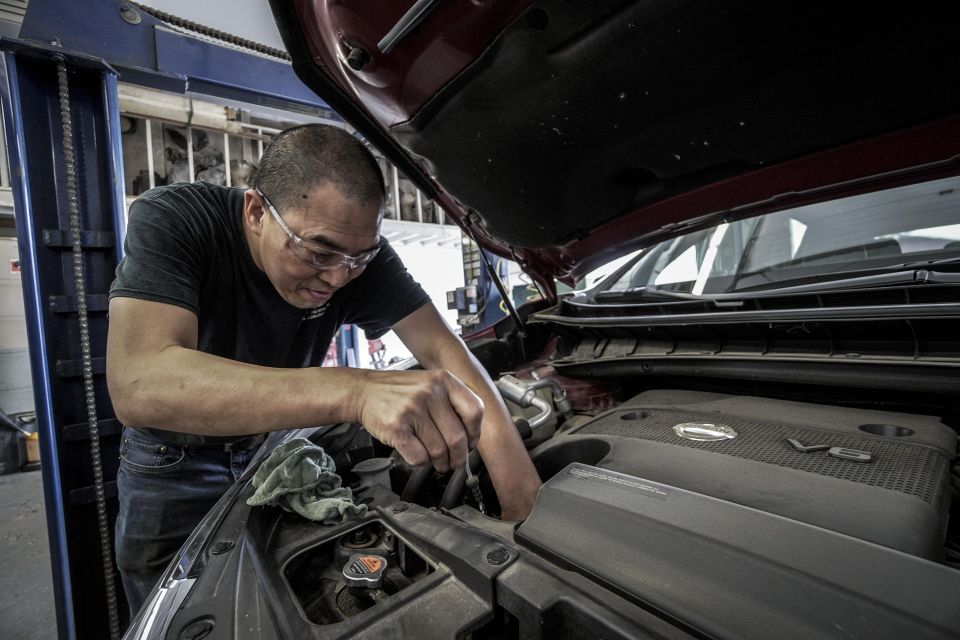 Custom website design for an auto body and collision repair shop showcasing before-and-after photos of vehicle repairs.