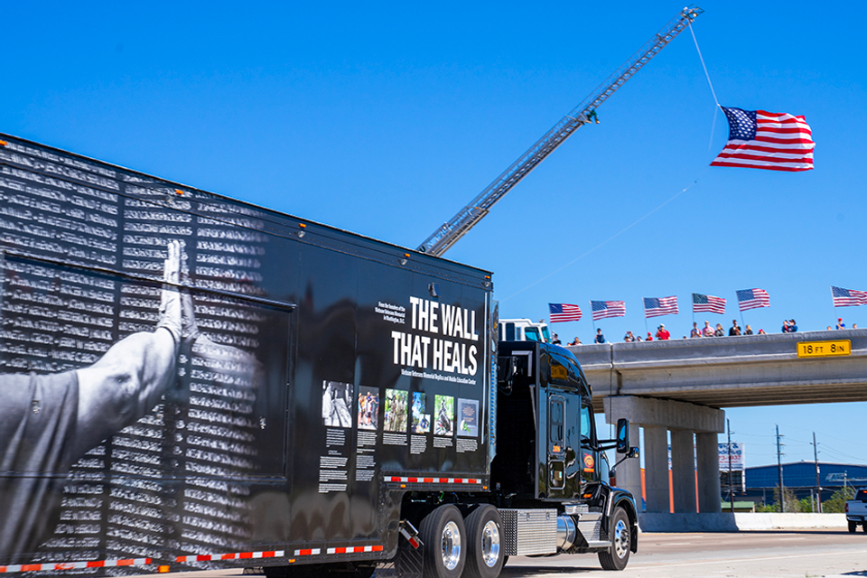 Twth truck   trailer during escort with flag
