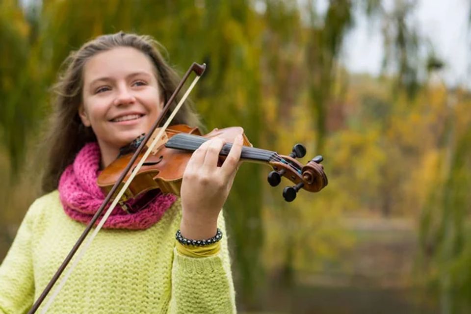 Depositphotos 223492088 stock photo girl playing violin smiling autumn