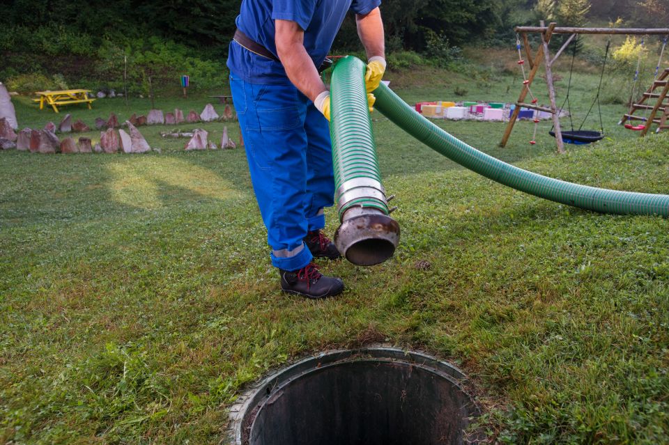 A septic tank cleaner about to pump a house sewer that is clogged