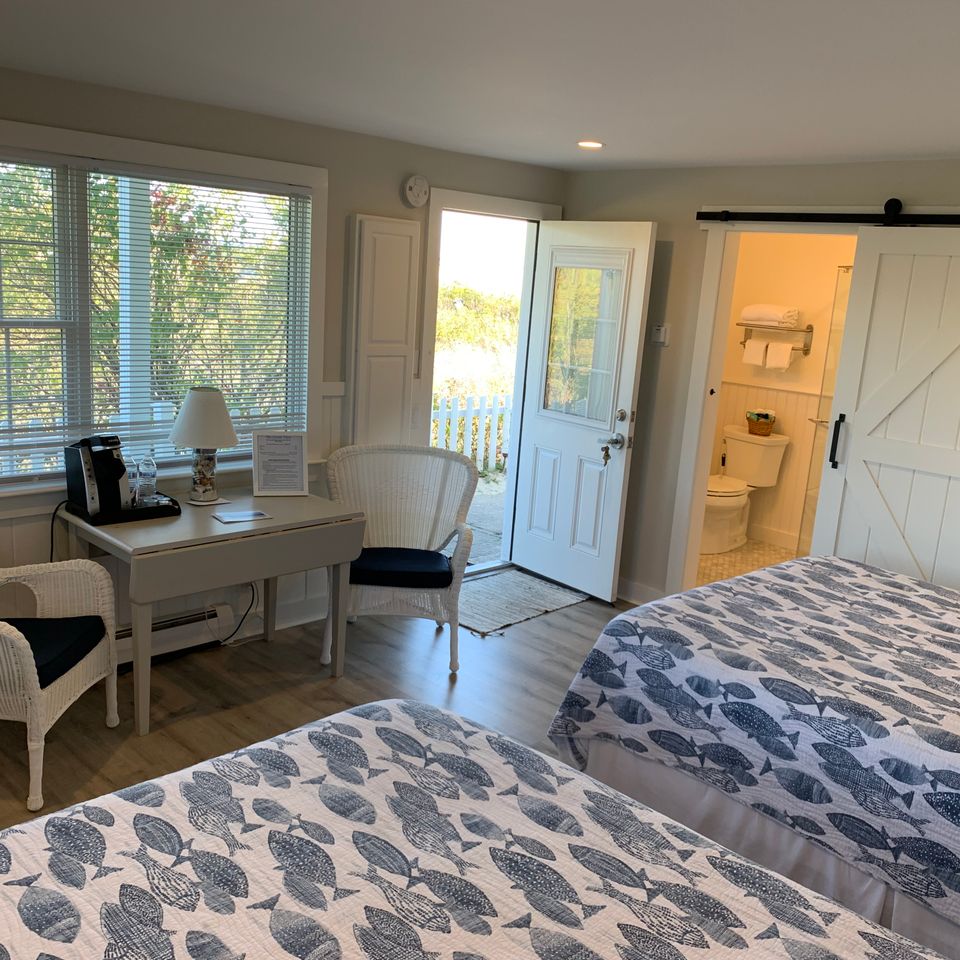 Brewster room with two queen beds patio access and renovated bathroom