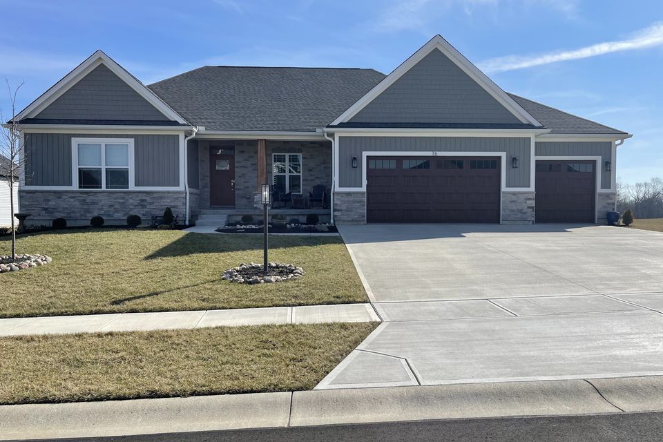 Gray ranch-style home with a professionally installed architectural asphalt shingle roof by E & D Roofing, Inc.