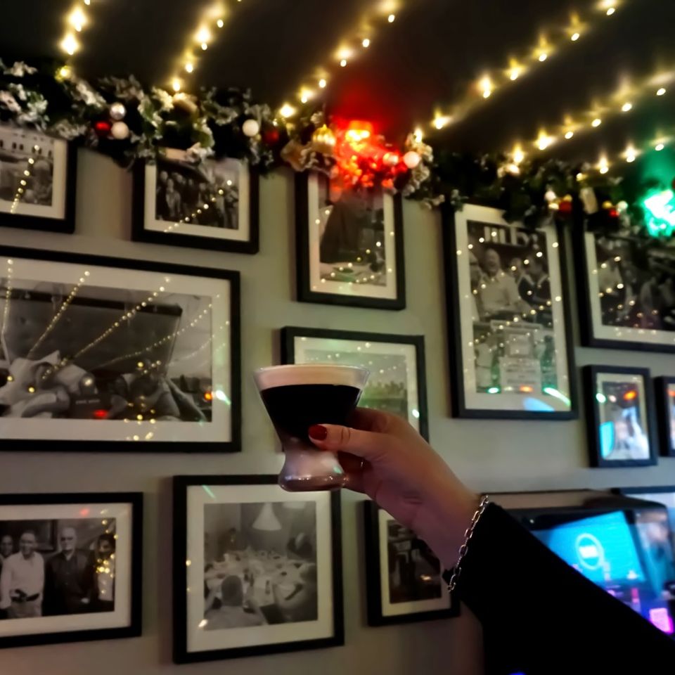 A customer holding up one of Jilly's famous expresso martini's