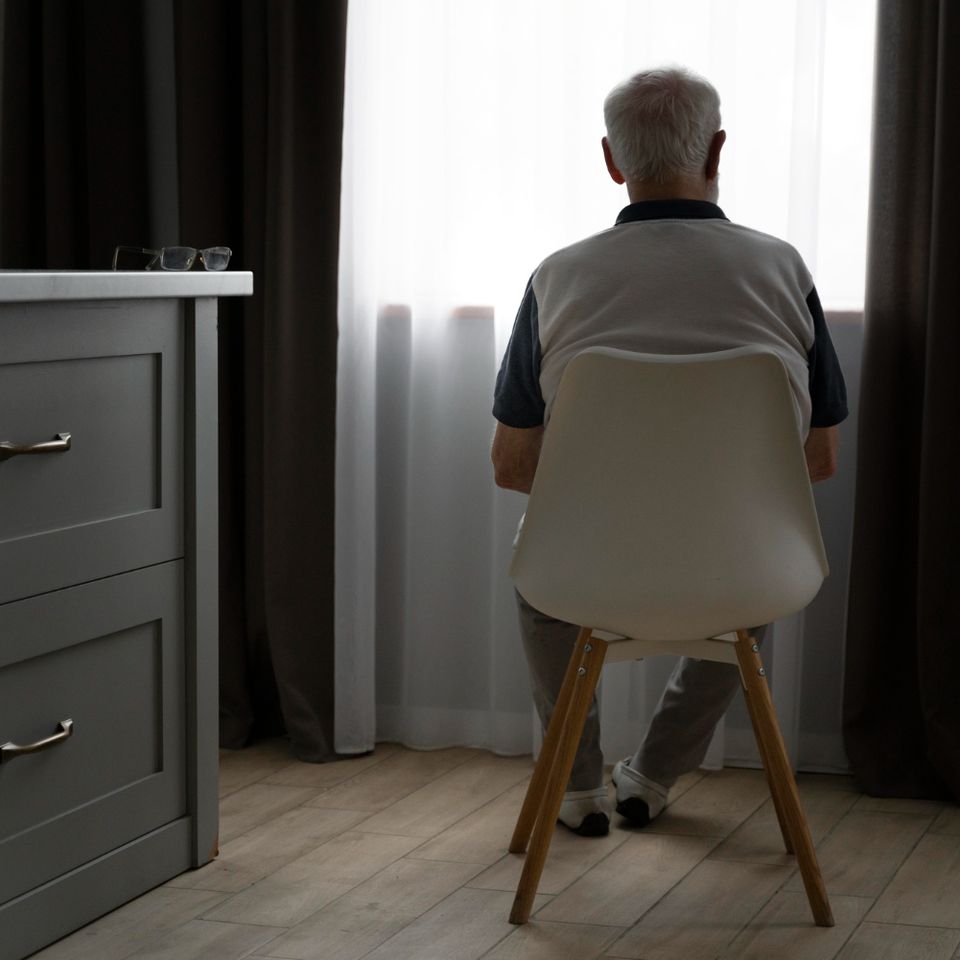 Back view senior man with alzeihmer indoors