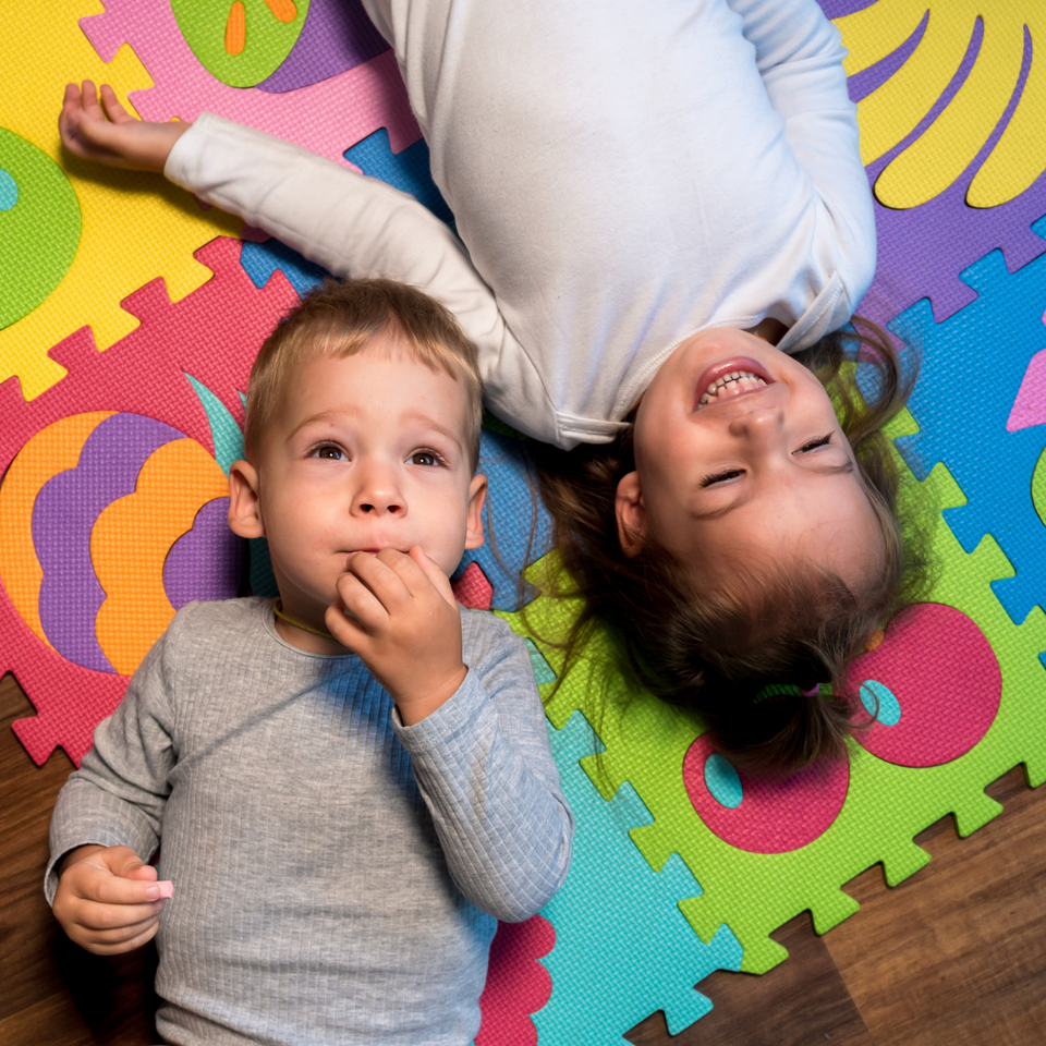 Two children on mat