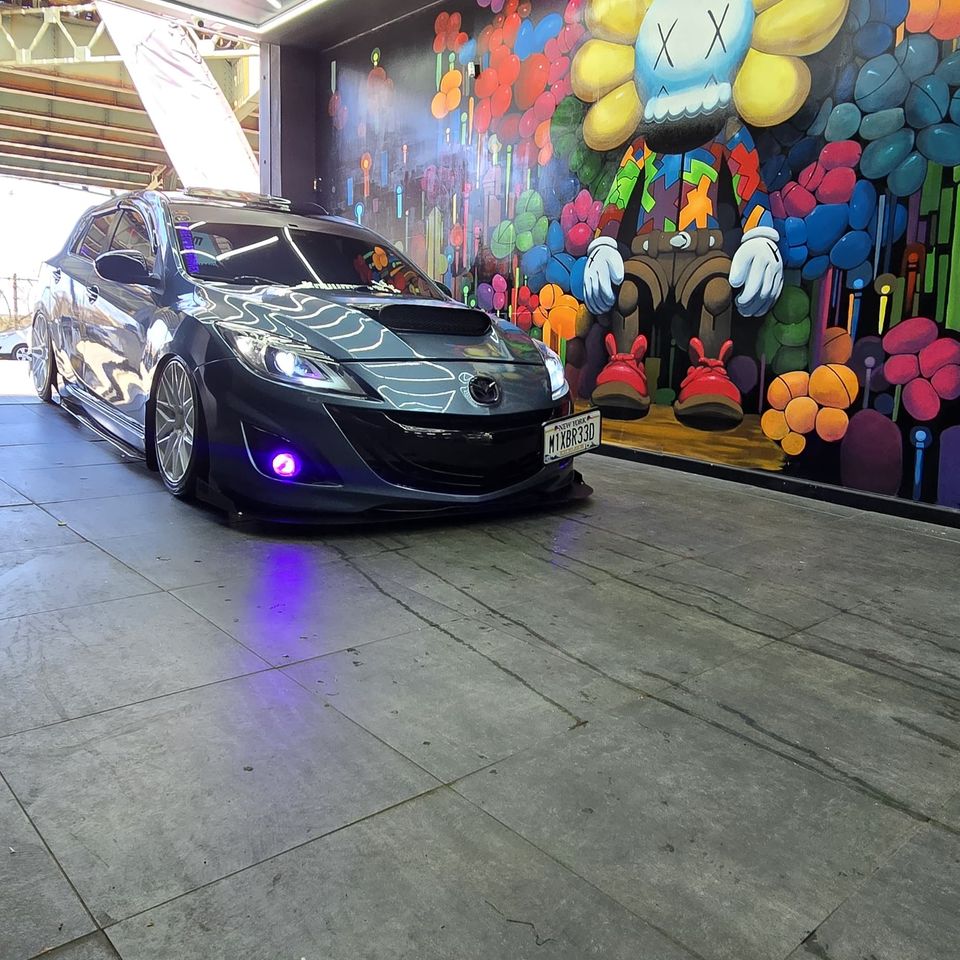 Professionally detailed black car with ceramic coating