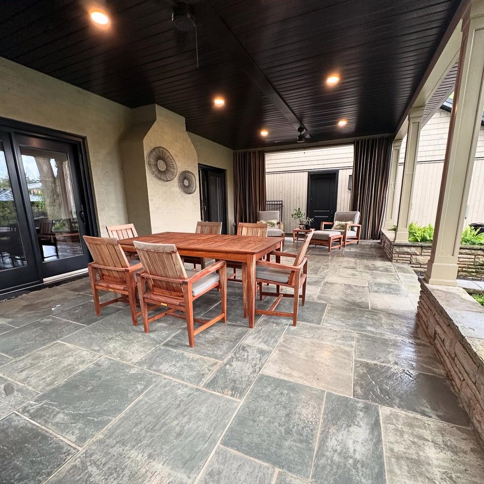 Freshly pressure washed flagstone patio under a covered porch at a Tillsonburg Ontario property