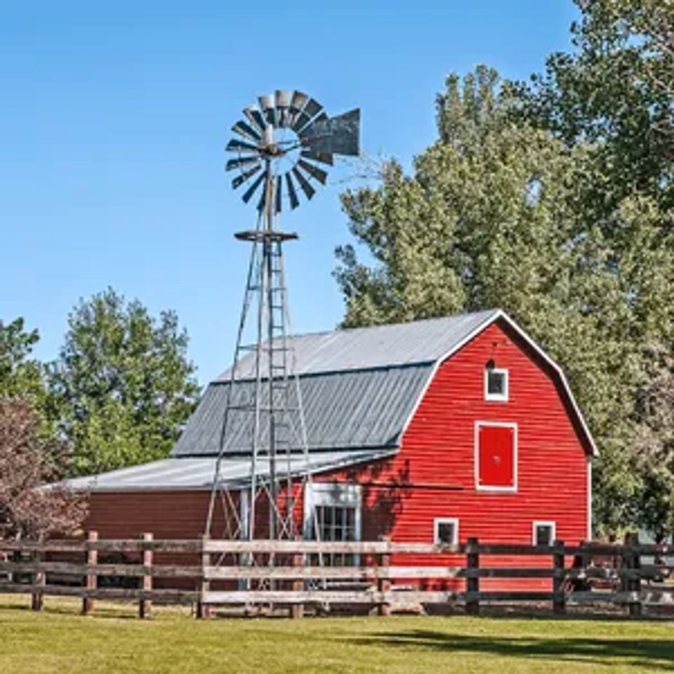 Red farm house with windmill