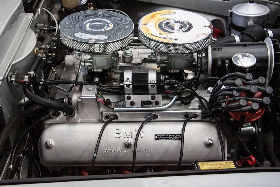 Image of a vintage BMW engine with twin carbs, individual filters and the motor is a rare Zunfolge engine