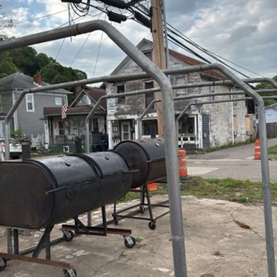 Outdoor BBQ smoker at Lickers Hometown BBQ used for slow-cooking meats.