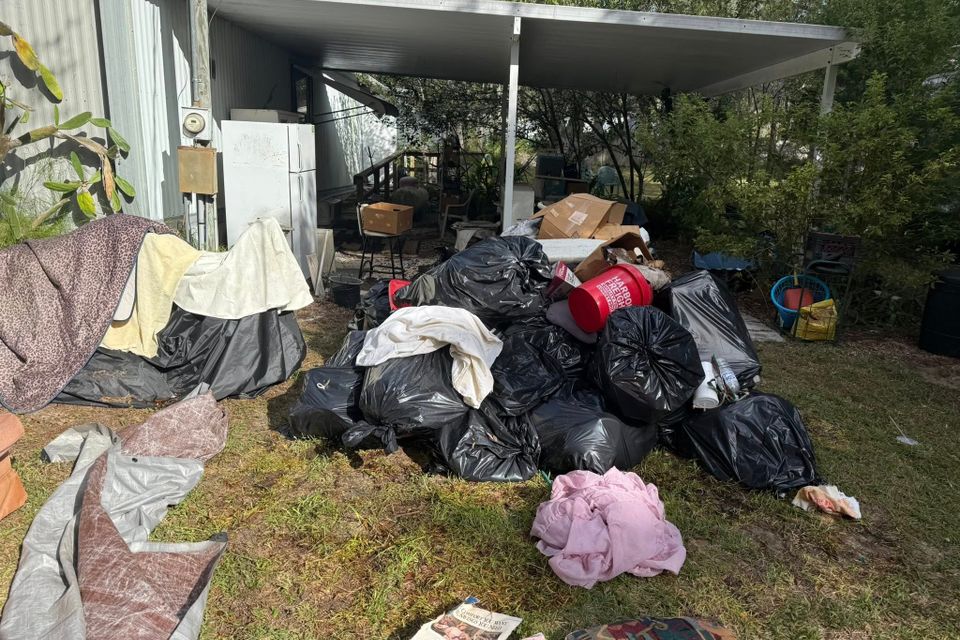 Junk in someone's yard, about to be hauled away by JNJ Hauling Solutions of Citrus County