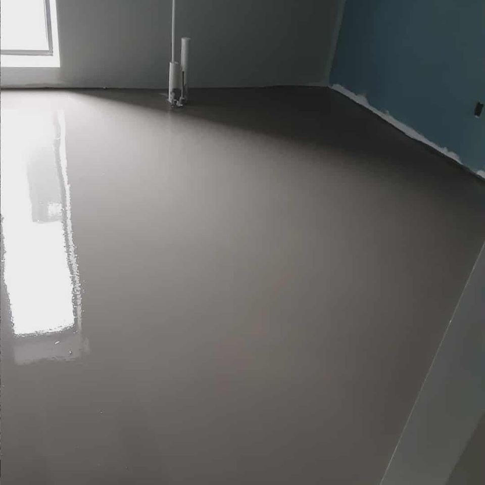 Smooth finished concrete floor in a modern interior room.