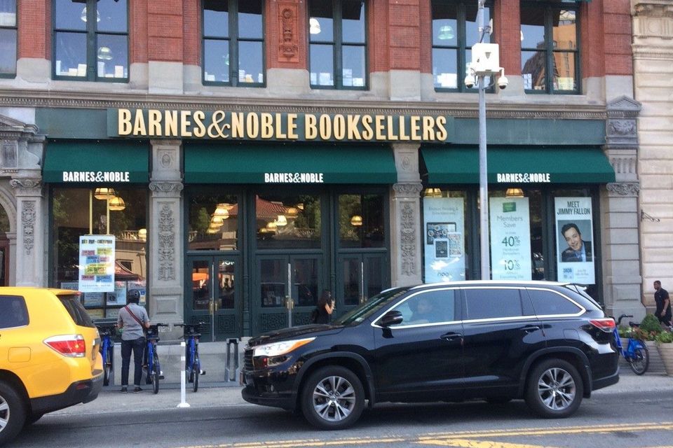 Green storefront awnings with printed Barnes & Noble lettering across the ground floor, with matching awnings over the upper windows, at Union Square in Manhattan