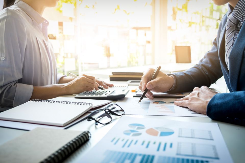 Business man financial inspector secretary making report calculating checking balance internal revenue service inspector checking document audit concept