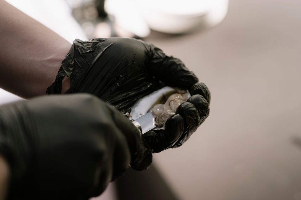 Clam shucking, done by Shore2Shore Shucking of Long Island