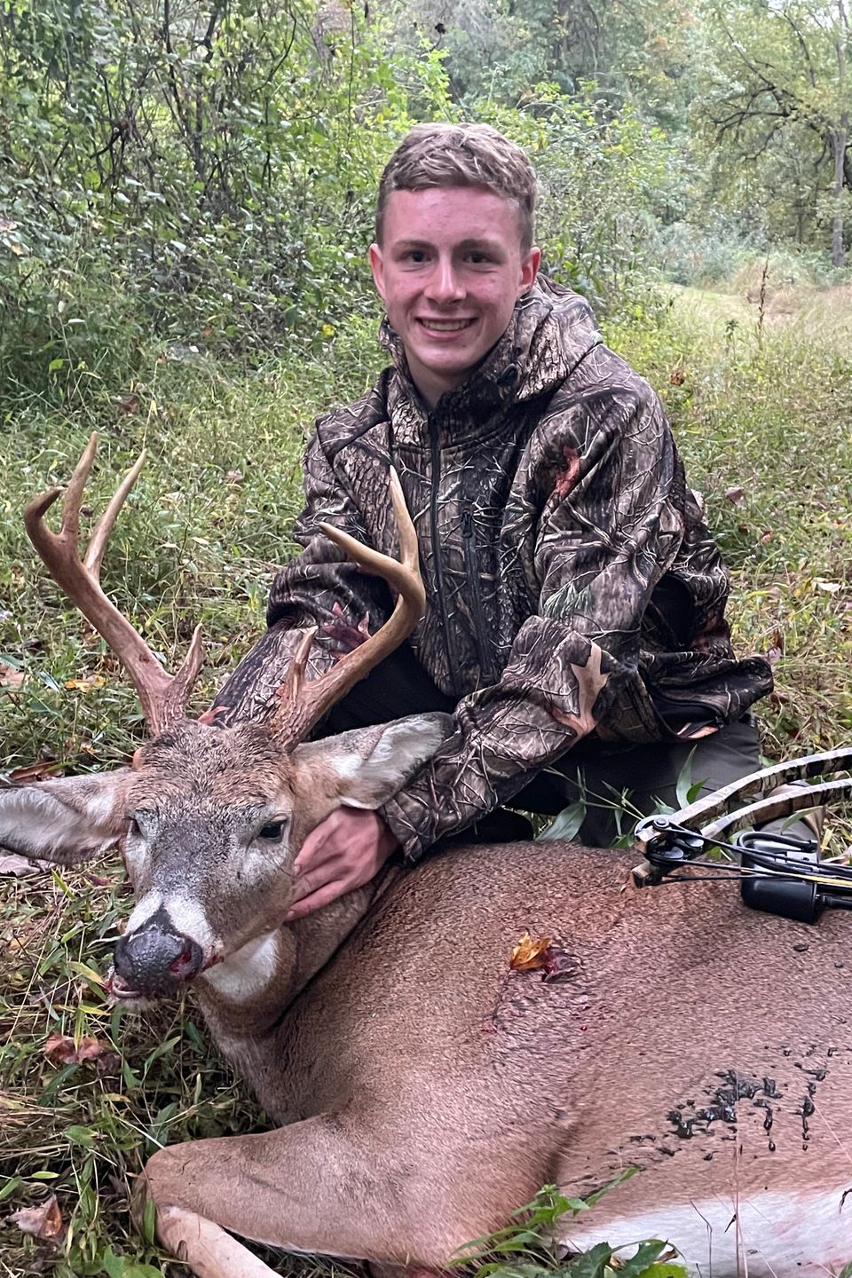 teenager archery hunting with buck in Lancaster County