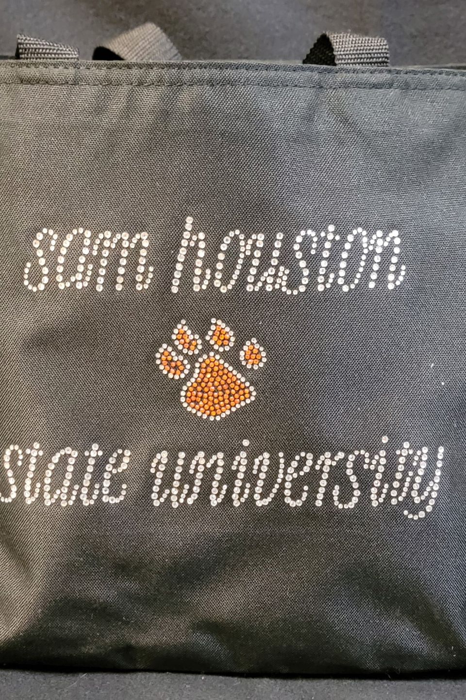 Rhinestone Bling tote bag example with rhinestones used in paw print design with wording Sam Houston State University 