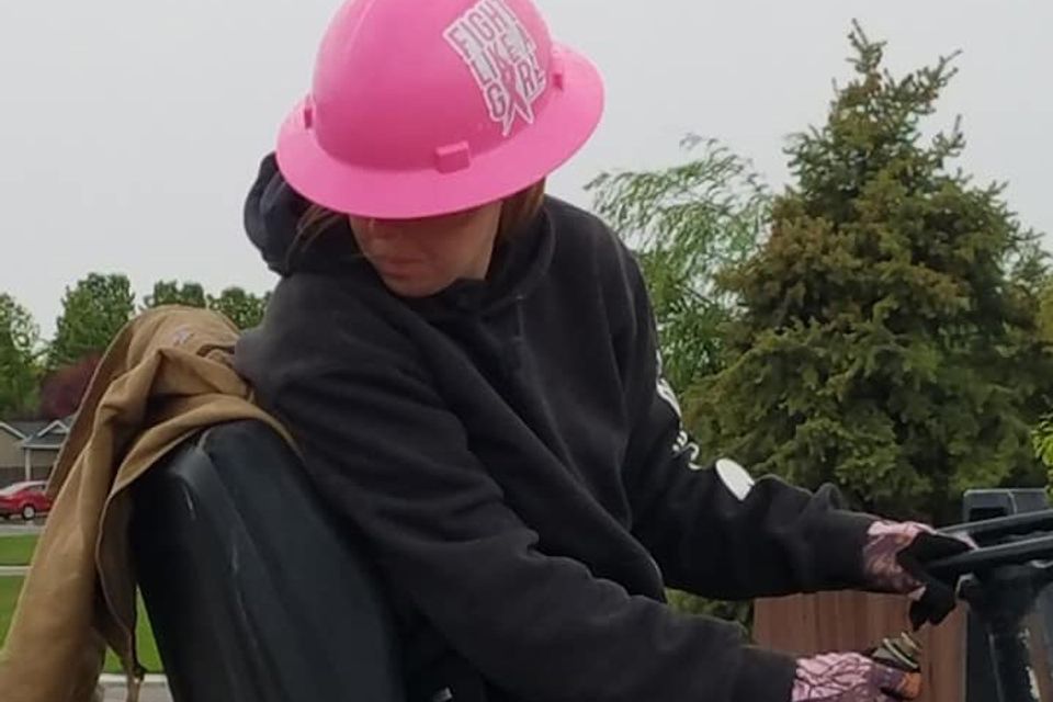Lady with pink hard hat cropped